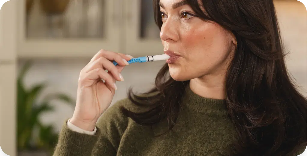 Collect a saliva sample using the at‑home kit.