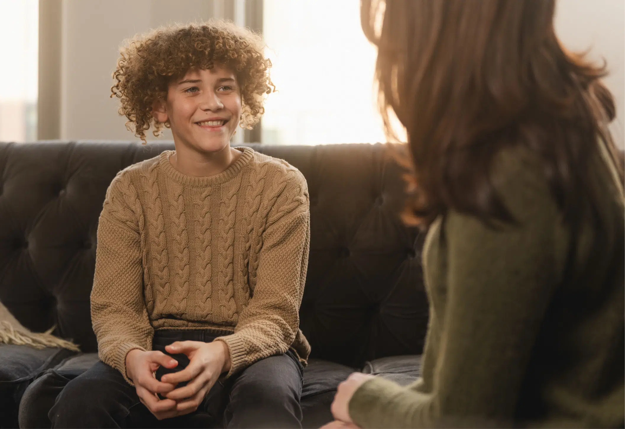 Couple smiling and brushing teeth together, representing oral wellness awareness
