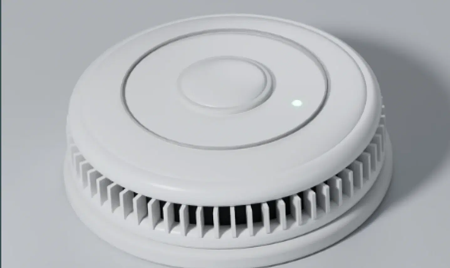 White optical smoke alarm with a green status light